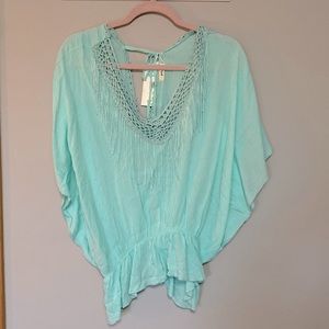 New it’s a Cinch Poncho top with fringe and tie in back